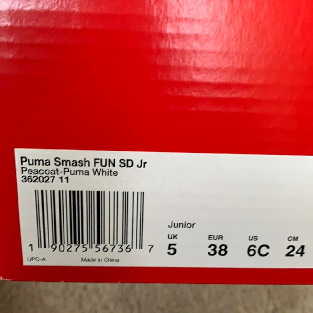 Kids Puma navy and white gym shoes